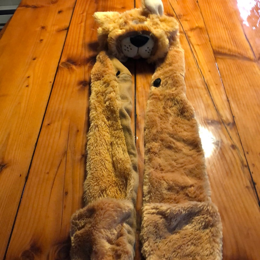 Lion hat with scarf attached.